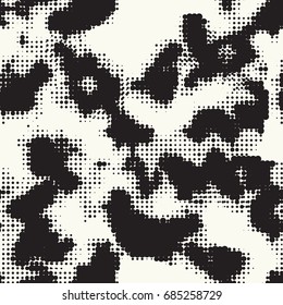 Seamless pattern ethnic style. Stylized animal skin imitation. Halftone textile print. Tribal fashion background. Black and white design.