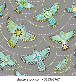 Seamless pattern. Ethnic stylish background. Vector repeat texture with stylized birds and triangles. 