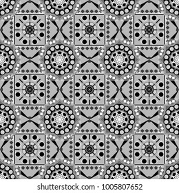 Seamless pattern in ethnic traditional style. Abstract vintage pattern with decorative tiles pattern. Vector oriental style in white, gray and black colors.