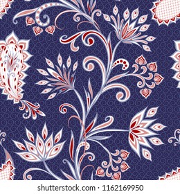 Seamless pattern in ethnic traditional style. Abstract vintage pattern with decorative flowers, leaves and Paisley pattern in Oriental style.