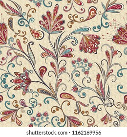 Seamless pattern in ethnic traditional style. Abstract vintage pattern with decorative flowers, leaves and Paisley pattern in Oriental style.
