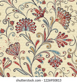 Seamless pattern in ethnic traditional style. Abstract vintage pattern with decorative flowers, leaves and Paisley pattern in Oriental style.