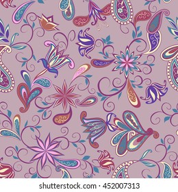 Seamless pattern in ethnic traditional style. The pattern of flowers and Paisley in Indian style.