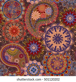 Seamless pattern in ethnic traditional style. The pattern of mandalas and Paisley pattern in Indian style.