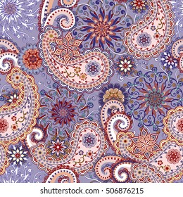 Seamless pattern in ethnic traditional style. The pattern of mandalas and Paisley pattern in Indian style.