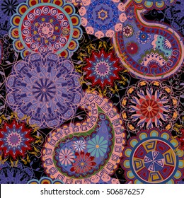 Seamless pattern in ethnic traditional style. The pattern of mandalas and Paisley pattern in Indian style.