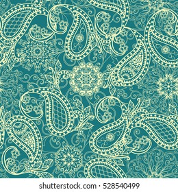 Seamless pattern in ethnic traditional style. The pattern of mandalas, flowers and Paisley pattern in Oriental style.