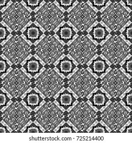 Seamless pattern in ethnic traditional style. Abstract vintage pattern with decorative tiles pattern. Vector oriental style in white, gray and black colors.