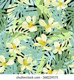 Seamless pattern of exotic flowers.Tropical flowers and palm leaves