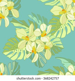 Seamless pattern of exotic flowers.Tropical flowers and palm leaves