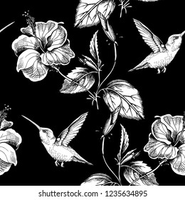 Seamless pattern. Exotic Hibiscus flowers and hummingbird. Textile composition, hand drawn style print. Vector black and white illustration.