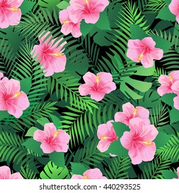 Seamless pattern with exotic hibiscus flowers and palm leaves. Endless tropical texture. 
