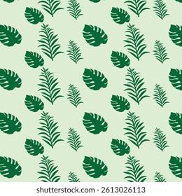 Seamless pattern of exotic leaves on a green background with tropical plants 