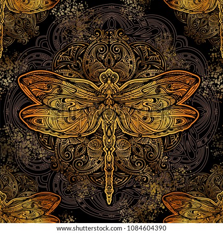 Seamless pattern - exquisite golden ornate stylized dragonfly against the background of the mandala. Spiritual, esoteric, totem symbol. Ethnic tribal patterns with elements of Ar Nouveau and Boho.
