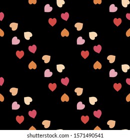 Seamless pattern with exquisite red, pink and orange hearts on black background for plaid, fabric, textile, clothes, tablecloth and other things. Vector image. 