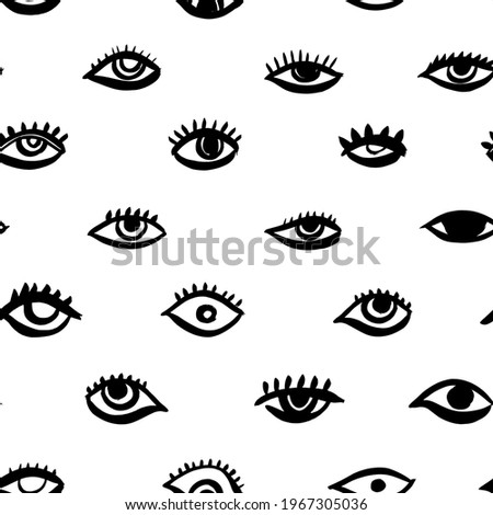 Seamless pattern with eyes and eyelashes. Black and white ink illustration. Free hand drawing bohemian style. Tribal print of open eyes. Ethnic background for web, fabric design, scrapbook elements