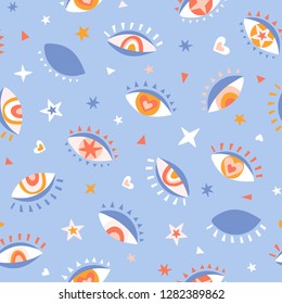 Seamless pattern with eyes, rainbows and stars. Mystical print. Vector hand drawn repeat background design for fabric or wrap paper.