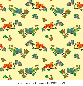 Seamless pattern with fabulous birds on branches and flowers. Yellow background