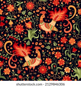 Seamless pattern with fabulous peacocks, leaves, berries, flowers in red-orange-green colors isolated on black background in vector. Beautiful summer print for fabric in vintage style.