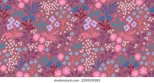 Seamless pattern with a fabulous spring meadow, various wildflowers, herbs. Delicate floral print, romantic botanical background with cornflowers, other flowers, leaves on a dark pink background.