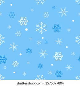 Seamless pattern with falling snowflakes on blue background vector illustration.