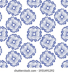 Seamless pattern with fancy flowers drawn by hand with a blue pen on a white background