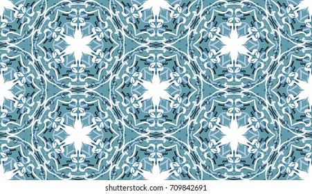Seamless pattern. Fantastic snowflakes are located like bees' honeycombs. The abstract six-sided figures. For backgrounds, fabrics, holidays. Blue-green, blue-gray & white.