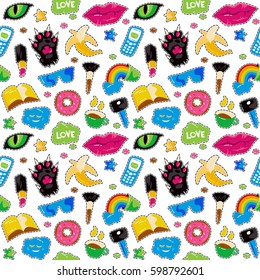 Seamless pattern with fashion patch badges. Lips, cat paw, cat eye and other elements. Colorful graphics in hand drawings style