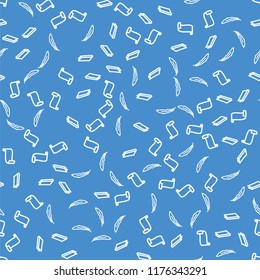 A seamless pattern of feathers, books and scrolls on blue background