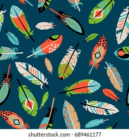 Seamless pattern with feathers on blue background