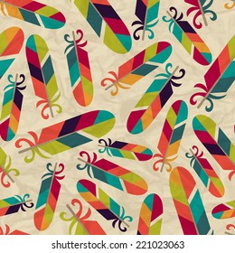 Seamless pattern with feathers on crumpled paper.