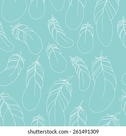 Seamless pattern feathers. Plumage on a blue background