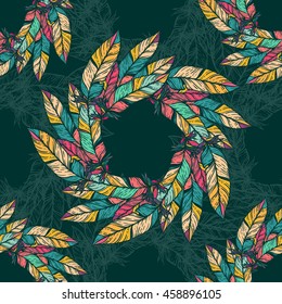 Seamless pattern with feathers. Round kaleidoscope of feathers and floral elements. Boho chic