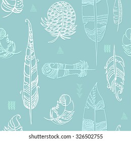 Seamless pattern with feathers. Turquoise and white. Vector.