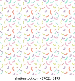 Seamless pattern featuring abstract sprinkles or confetti shapes in soft pastel colors