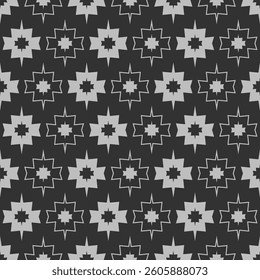 A seamless pattern featuring layered, sharp-edged starburst shapes in gray on a black background, creating a bold, symmetrical, and visually striking geometric design.