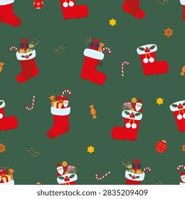 Seamless pattern featuring red Christmas stocking boots, candy canes, and festive decorations on a green background.