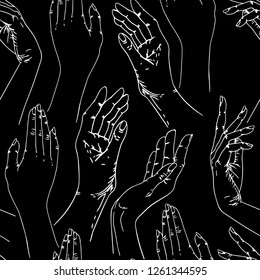 Seamless pattern of female hands on black background.
