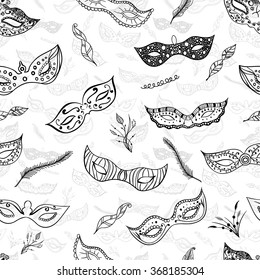 Seamless pattern festive black hand drawn mask silhouette on the white background. Great wallpaper for carnival party invitation or card. Mardi Gras masks.