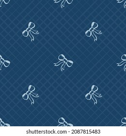 Seamless pattern with festive bows on a dark blue background in a light cell