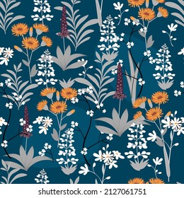 Seamless pattern of field herbs and flower yellow and white colors on blue.Spring or summer floral background and texture for printing on fabrics and paper.Trendy hand drawn vector illustration.
