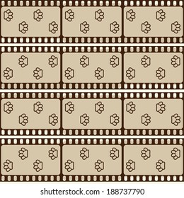 Seamless pattern with film strips and pet paws, brown retro background, vector illustration