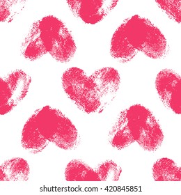 Seamless pattern with fingerprint hearts. Hand drawn heart shapes with rough edges. Trendy texture. Endless stylish backdrop. Pink thumbprints on white background. Fabric, wallpaper, wrapping