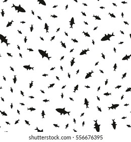 Seamless pattern of fish in different sizes, floating in a chaotic manner. Vector illustration