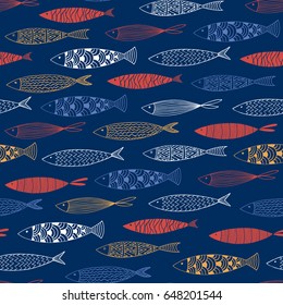 Seamless pattern with fish on a blue background.Vector