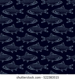 Seamless pattern with fish on a dark blue background