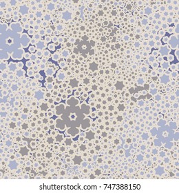 Seamless pattern. Five-color palette. Snowy whirlwinds among which are visible individual snowflakes.