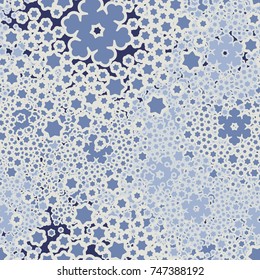 Seamless pattern. Five-color palette. Snowy whirlwinds among which are visible individual snowflakes.