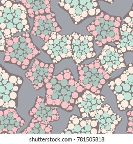 Seamless pattern. Five-pointed stars with rounded corners covered with round spots.