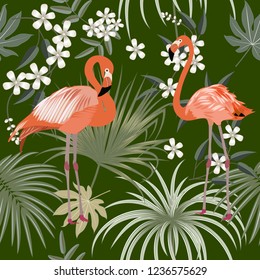 Seamless pattern of flamingo, leaves monstera. Tropical leaves of palm tree and flowers. Vector background.